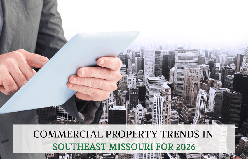 High rise building in the back with a man holding a piece of paper reviewing commercial property trends in Southeast Missouri for 2026.